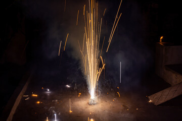 Yellow color flower pots fireworks(tubri) burning on the ground