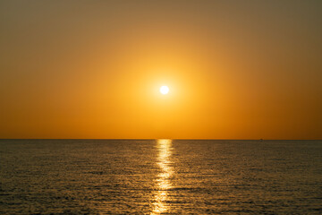 sunset at sea during calm weather