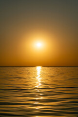 sunset at sea during calm weather