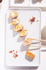 Carbonara sushi style  maki rolls, reshaping a traditional dish from italy