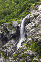Huge waterfall in Norway falling down the rock