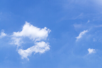 Fototapeta na wymiar Blue sky background with strange and fantastic cloud