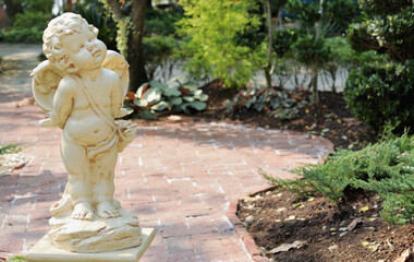 Fototapeta na wymiar Cupid statue in the park