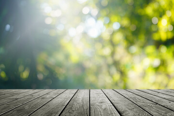 Wooden table and blurred green nature bokeh background for product.