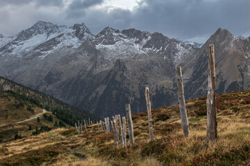 sunset landscape panorama of mountain trail with touristic sign in ski resort Zillertal arena in the Alps Austria 
