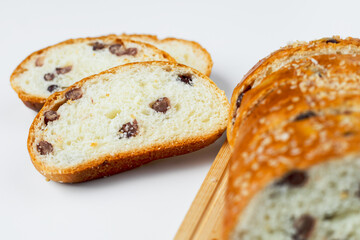 Vegan sliced fine whole wheat bread on white background for bakery, food and eating concept