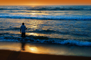 person walking on the beach