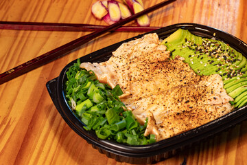 Japanese dish of avocado, chicken and tempura sushi