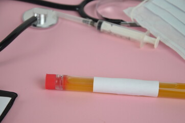 Stethoscope with clipboard and Laptop on desk,Doctor working in hospital writing a prescription, Healthcare and medical concept,test results in background,vintage color,selective focus