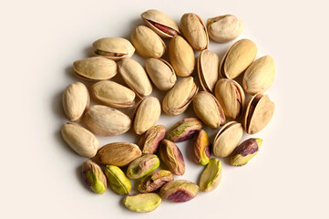 Pistachios in walnut shell on white background, composition of pistachios excellent for a healthy and dietetic diet,antioxidant food