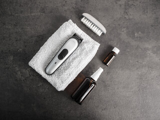 Set of grooming accessories on a concrete background, flat lay top view