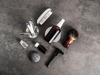 Set of grooming accessories on a concrete background, flat lay top view