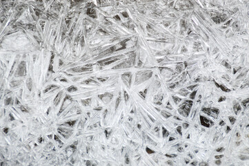 frost pattern forming on a frozen water surface