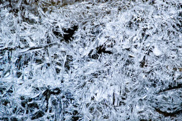 frost pattern forming on a frozen water surface