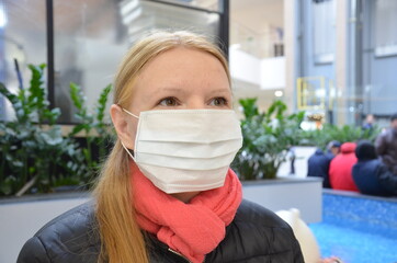 Woman wearing face mask because of Air pollution or virus epidemic in the city