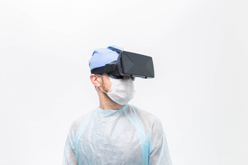 male doctor surgeon in uniform and VR glasses helmet, the use of virtual reality in medicine. Modern technologies in teaching.