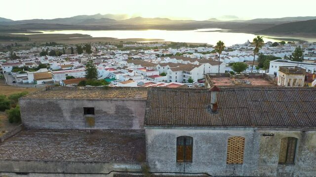 An aerial drone shot during sunrise of the town Bornos at Embalse de Bornos in Andalucia, Spain.
