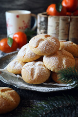 Winter festive baking. Homemade tangerine cookies, powdered sugar dressing