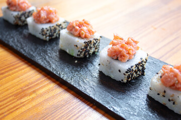 small sushi with salmon topping