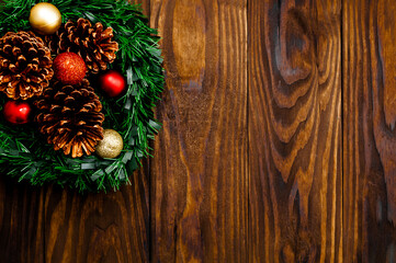 Christmas background with space for text and decoration on dark wooden board