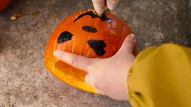 Carving a pumpkin with a special knife. Stencil cut sheep skin. Make Jack a lantern in self-isolation at home. Alternative action in spare time.