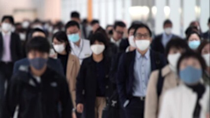 Covid-19 : Crowd of people wearing masks walking to work in Tokyo, JAPAN / slow motion - Powered by Adobe