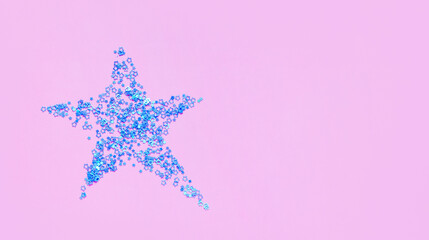 Fototapeta na wymiar creative holiday concept: star made of blue mini stars on color background