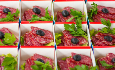 Various types of snacks. Selective focus. Meals on board. Catering service. Meat.