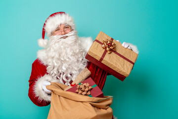 Santa Claus holding a sack filled with Christmas presents