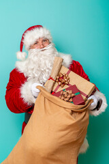 Santa carrying a sack full of Christmas presents