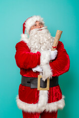 Santa holding Christmas presents wish list
