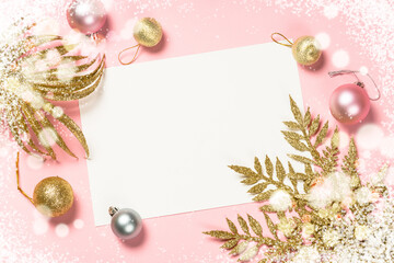 Fototapeta na wymiar Christmas pink flat lay background with present box and decorations.