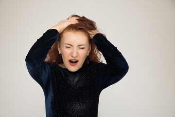 Beautiful girl red hair portrait close-up surprise emotion