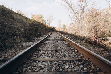 Obraz premium Metal rails, sleepers, railway, autumn