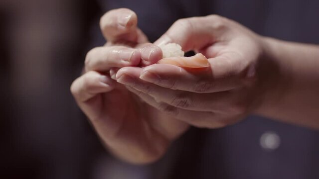 Handmad nigiri sushi. Creating amazing sushi and sashimi at a high-end sushi restaurant. Shot in 4k.
