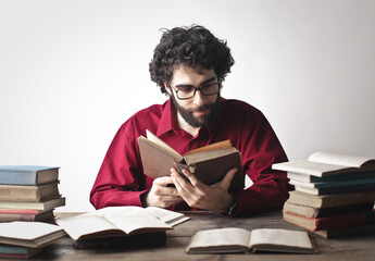 man reads a book at home