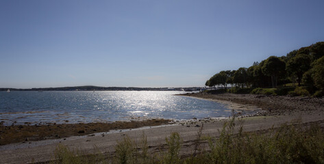 Beautiful Maine coastal view with the sun sparkling off the water