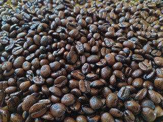 Freshly roasted coffee beans, can be used as a background,