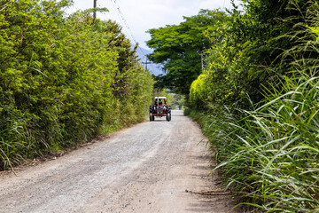 Tractor at an unpaved rural road at El Cerrito in the Valle del Cauca region in Colombia