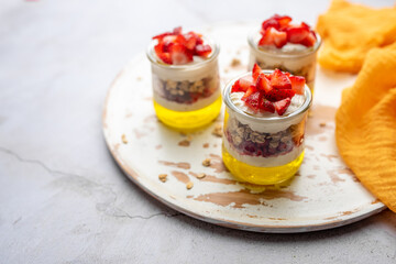Dessert Parfait glass cup, with lemon jello, yogurt and fresh strawberries. 