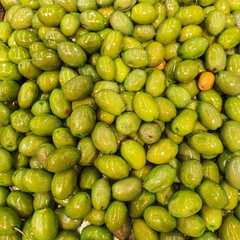 Background of green olives close up