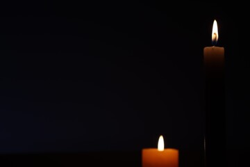 Candle black background of mourning funeral moment of silence	