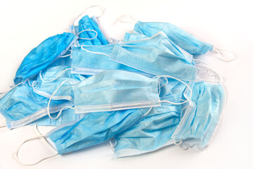 A large amount of used disposable masks. Hazardous waste. Coronavirus. Environment pollution