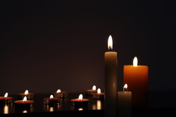 Candle black background of mourning funeral moment of silence	