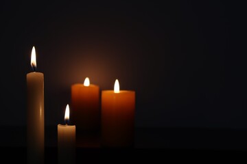 Candle black background of mourning funeral moment of silence	