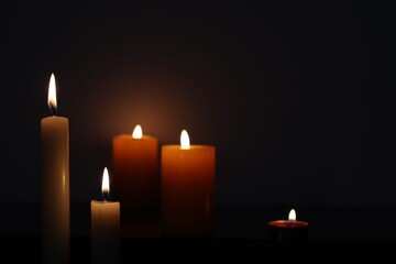 Candle black background of mourning funeral moment of silence	