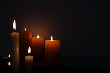 Candle black background of mourning funeral moment of silence	