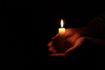 Candle black background of mourning funeral moment of silence	