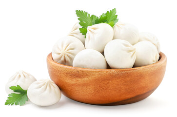 Boiled khinkali with herbs in a plate on a white plate. Isolated