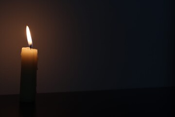 Candle black background of mourning funeral moment of silence	